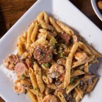 Sandy'S Cajun Pasta · One of our signature dish! Comes with sausage, shrimp, and Rotini rainbow pasta in Cajun cre...