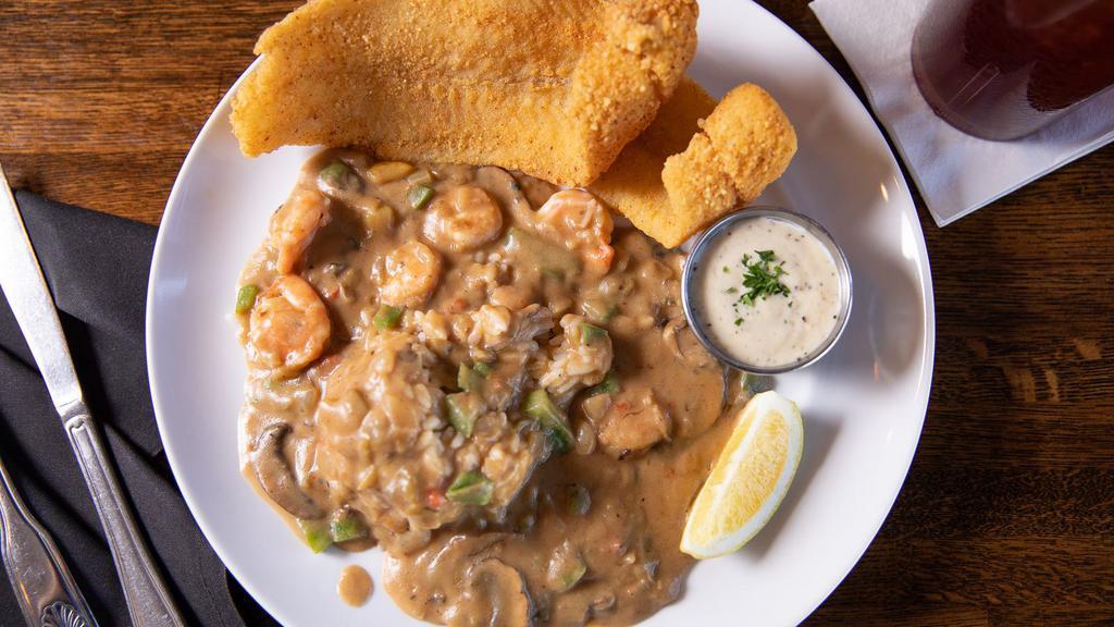 Deleon Catfish · Two fillets of crispy fried catfish served on our shrimp etouffee and rice. Comes with a side of your choice. You could also add an extra fish filet on the menu section 