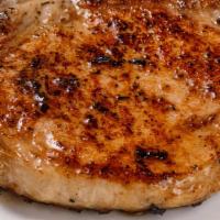 Double Grilled Pork Chops · Two grilled  marinated pork chops.  Serves with two sides of your choice.