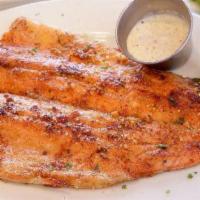 Cajun Trout · Lightly seasoned whole rainbow trout filet cooked on the griddle. Comes with two sides of yo...