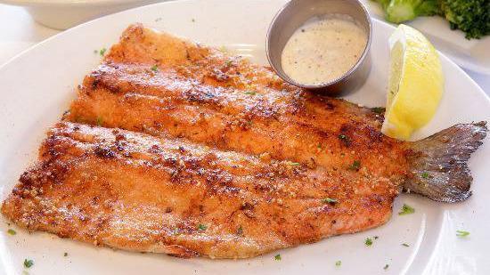 Cajun Trout · Lightly seasoned whole rainbow trout filet cooked on the griddle. Comes with two sides of your choice.