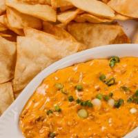 Nacho Con Queso · Fresh fried tortilla chips serve with nacho and ground beef.