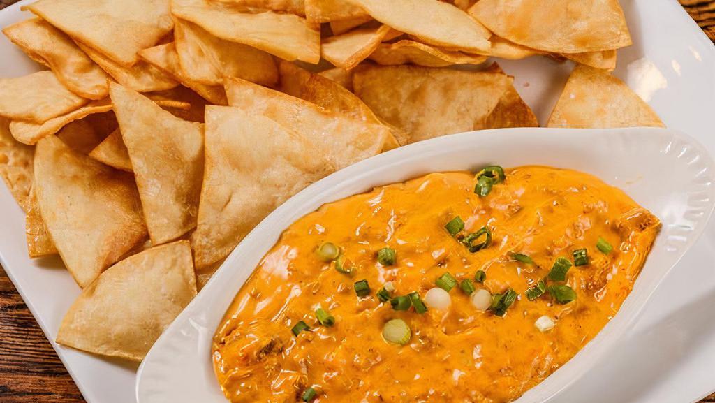 Nacho Con Queso · Fresh fried tortilla chips serve with nacho and ground beef.