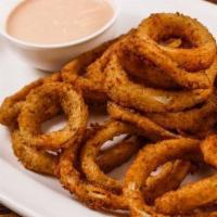 Onion Rings · House made onion rings served with our sauce.