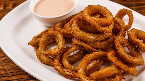 Onion Rings · House made onion rings served with our sauce.