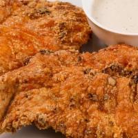 Chicken Fried Chicken · Two cuts of fried marinated chicken breasts. 
You can also add an extra piece of chicken fri...