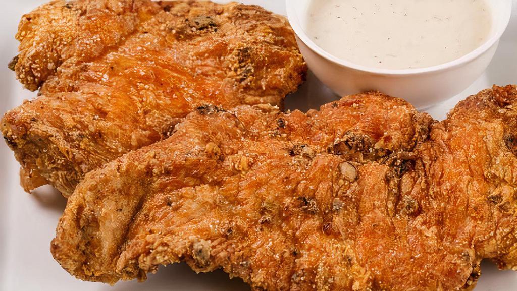 Chicken Fried Chicken · Two cuts of fried marinated chicken breasts. 
You can also add an extra piece of chicken fried chicken on the menu section 