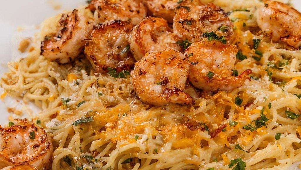 Shrimp Garlic Noodles · Thin spaghetti and shrimps tossed in our garlic butter seasoning, accented with Parmesan cheese and fried shallots.