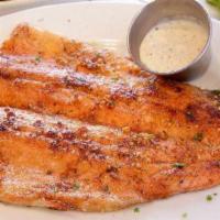 Cajun Trout · Lightly seasoned whole rainbow trout filet cooked on the griddle. Includes two sides of your...