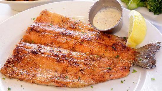 Cajun Trout · Lightly seasoned whole rainbow trout filet cooked on the griddle. Includes two sides of your choice.