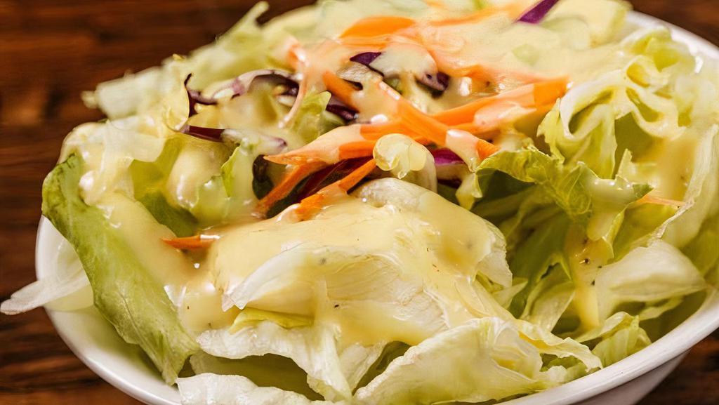 Salad (Iceberg Lettuce) · Your choice of ranch, thousand island, French, Italian, blue cheese, or Caesar salad dressing.