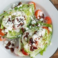 Baby Wedge · Tomatoes, candied pecans, goat cheese, Alabama white vinaigrette.