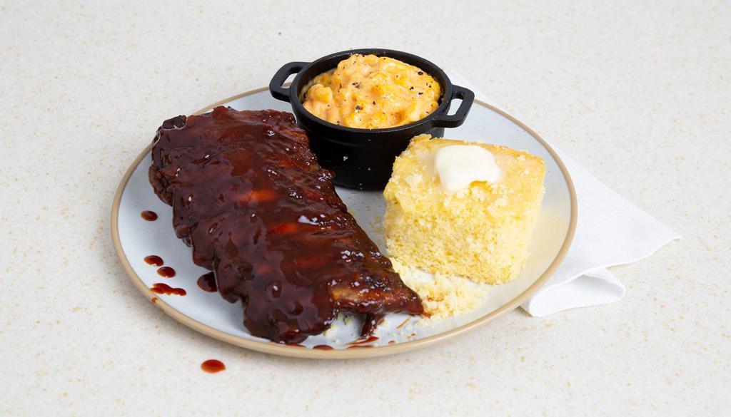 Bbq Beef Ribs · Fall-off-the-bone beef ribs covered in our house BBQ sauce with your choice of two sides.
