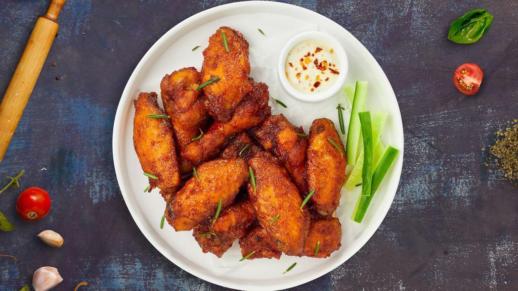 Wings · Classic bone-in wings oven- baked, cooked to order perfectly crisp, and tossed with your choice of delicious sauces.