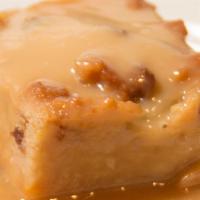 Homemade Bread Pudding · With a rum custard sauce.