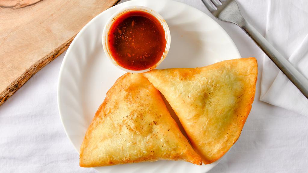 Samosa Vegetable (Two) · Crisp turnover, filled with mildly spiced potatoes and peas.2pcs
