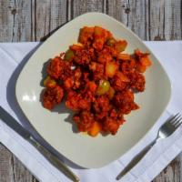 Gobi Manchurian · Cauliflower florets batter fried and coated with chille soy sauce.