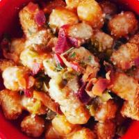 Tater Bangers · Crispy tots tossed in our secret 