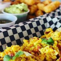 Breakfast Tacos · Scrambled egg, bacon and cheddar cheese