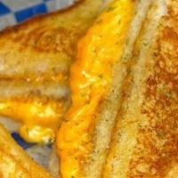 Grilled Cheese · American and cheddar.  Served on Sourdough Bread with fries.