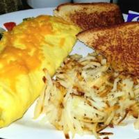 Meat & Cheese Omelette · Your choice of meat and cheddar cheese, w/ choice of taters & bread choice.