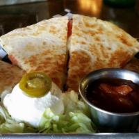 Quesadilla · Chicken, Steak or Bacon with onions, tomatoes, and pepper jack cheese, with sour cream and s...