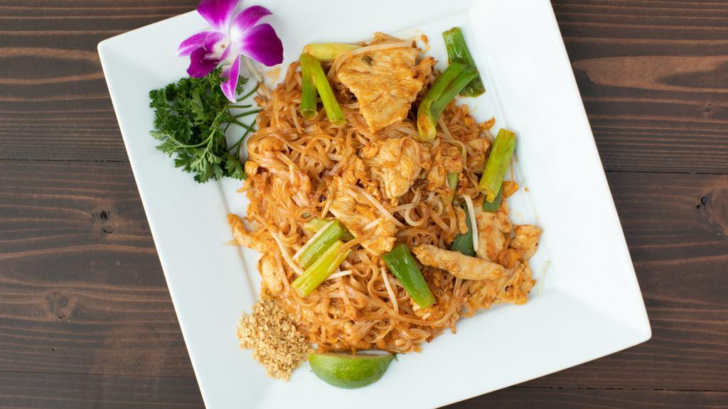 Pad Thai · Stir fried thin rice noodles with shrimp, chicken, greem, onions, bean sprots, eggs, and ground peanuts.
