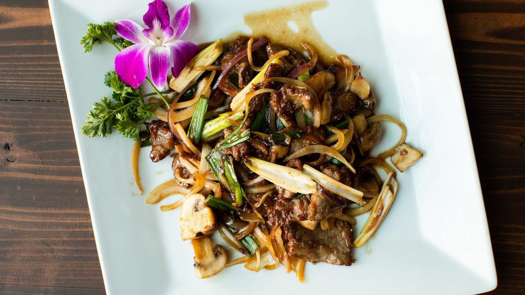 Mongolian Beef · Stir-fried beef with scallions and onions in sweet oyster sauce.