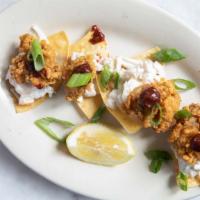 Crispy Oyster Tostadas (4) · Fried oysters served on a crispy tortilla and topped with our French Quarter-famous St. Loui...
