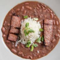 Creole Red Beans & Rice · Grilled andouille Sausage served with creamy red beans and rice.