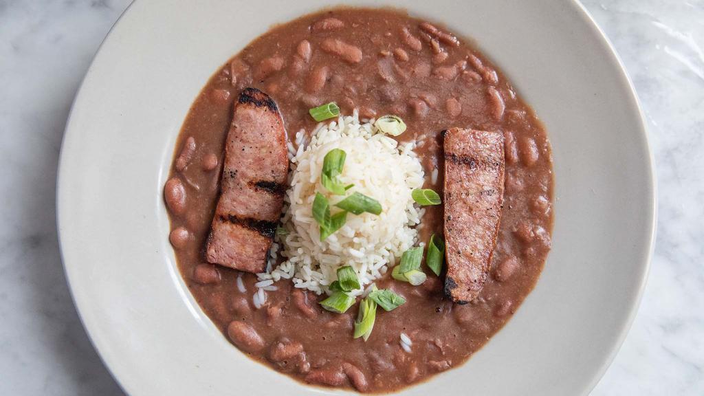 Creole Red Beans & Rice · Grilled andouille Sausage served with creamy red beans and rice.