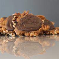 Caramel Turtles · Two turtles (will average a half pound).

Roasted and salted pecans, covered in our homemade...