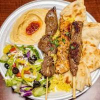 Mixed Grill Platter · A combination platter of one chicken, beef and kafta kabob with hummus, salad and hot pita b...