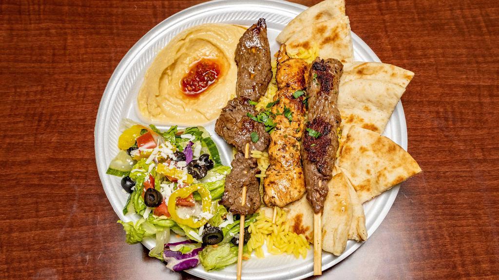 Mixed Grill Platter · A combination platter of one chicken, beef and kafta kabob with hummus, salad and hot pita bread.