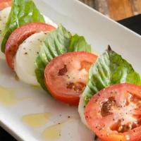 Caprese Salad · Fresh Mozzarella, sliced tomatoes, basil, Kalamata Olives, Balsamic glaze drizzle and olive ...