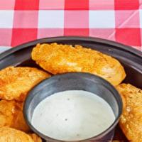 Jalapeno Poppers · Cheese stuffed Jalapeno Peppers deep fried and served with a side of Ranch Dressing