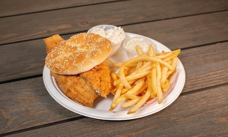 Fish Sandwich · Cole slaw, fries, tartar sauce.
