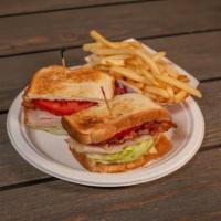 Club Sandwich · Bacon, turkey, lettuce, tomato and mayo, with fries.