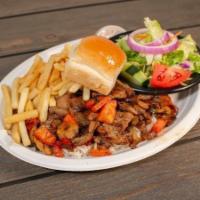 Tenderlion Tips · Over rice with mushrooms, onions, peppers and tomato Salad, fries and dinner roll.