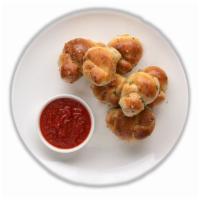 Garlic Knots (6) · Freshly baked and served with your choice of side sauce