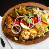 Tandoori Combo Tikka · Combination of chicken tikka, Malai chicken, tandoori shrimp and Paneer