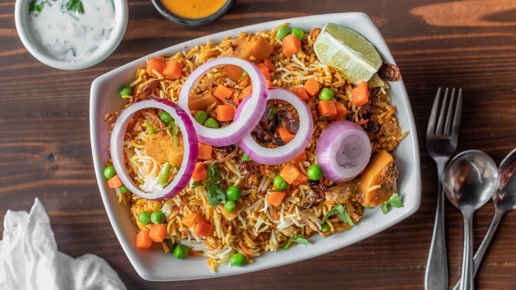 Vegetable Biryani · Basmati rice and vegetables dum cooked with spices.