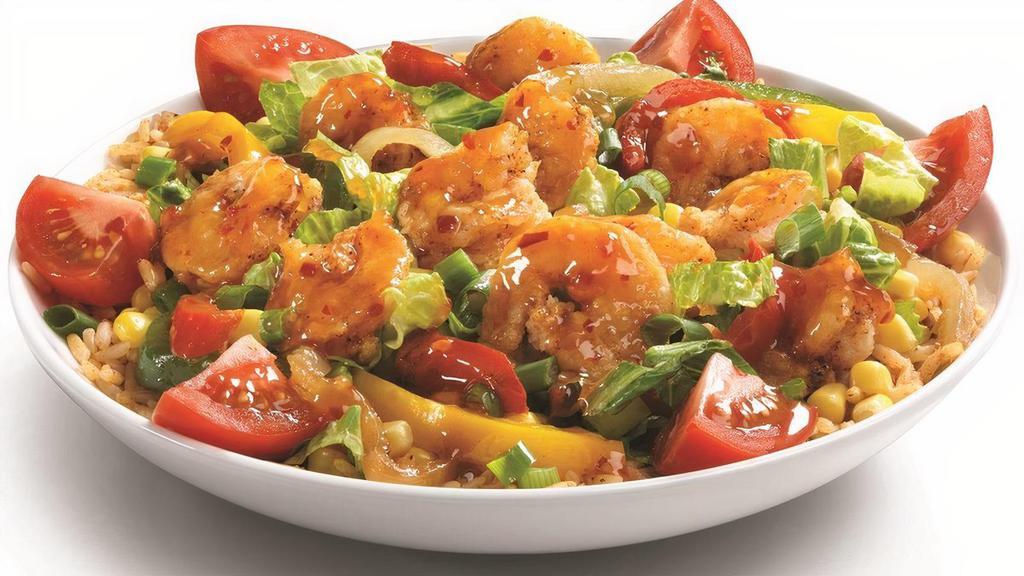 Bangkok Shrimp Bowl · Bangkok Shrimp on a bed of Mexican rice, grilled peppers and onions, and shredded Romaine, garnished with fire roasted corn salsa, tomato chunks, and green onions then drizzled with Sweet Red Chili sauce.
