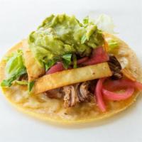Carnitas Verde Taco · Pork carnitas, Enchilada Verde sauce, crunchy tortilla crisps, Jack cheese, Sriracha pickled...