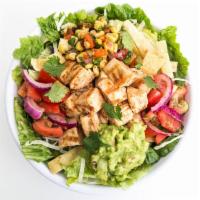 Southwest Mesquite Chicken Salad · Grilled mesquite chicken served on top of crisp greens with Jack cheese, guacamole, fiesta t...
