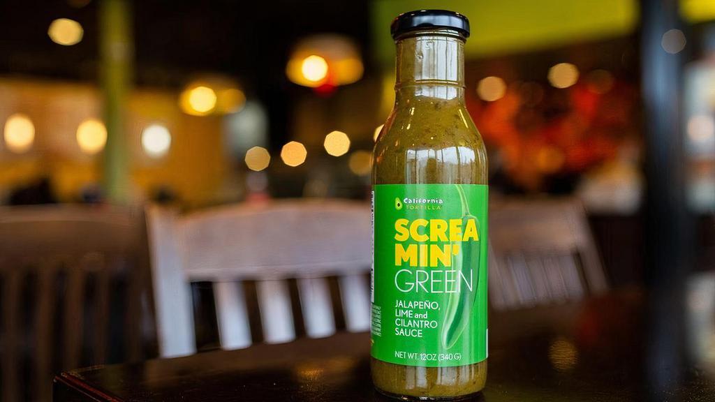 Bottle Of Screamin' Green · A bottle of our vibrant green sauce that's bursting with lime cilantro flavor and finished off with a jalapeño flare