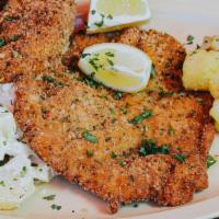 Schnitzel Platter (Pork) · Fried breaded pork loin with warm and cold potato salad.