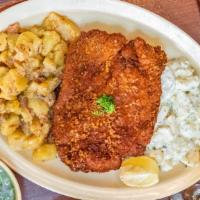 Hunter Schnitzel Platter (Pork) · Fried breaded pork loin in a mushroom and onion sauce served with mashed potatoes & caraway ...