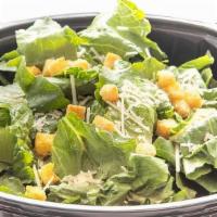 Caesar Salad · Crisp Salad greens, carrots, diced tomato, shredded Cheddar Cheese topped with your choice o...