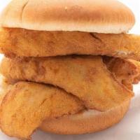 Kids Whiting Sandwich · A kids sized portion of whiting on a small bun, one side and a small drink.